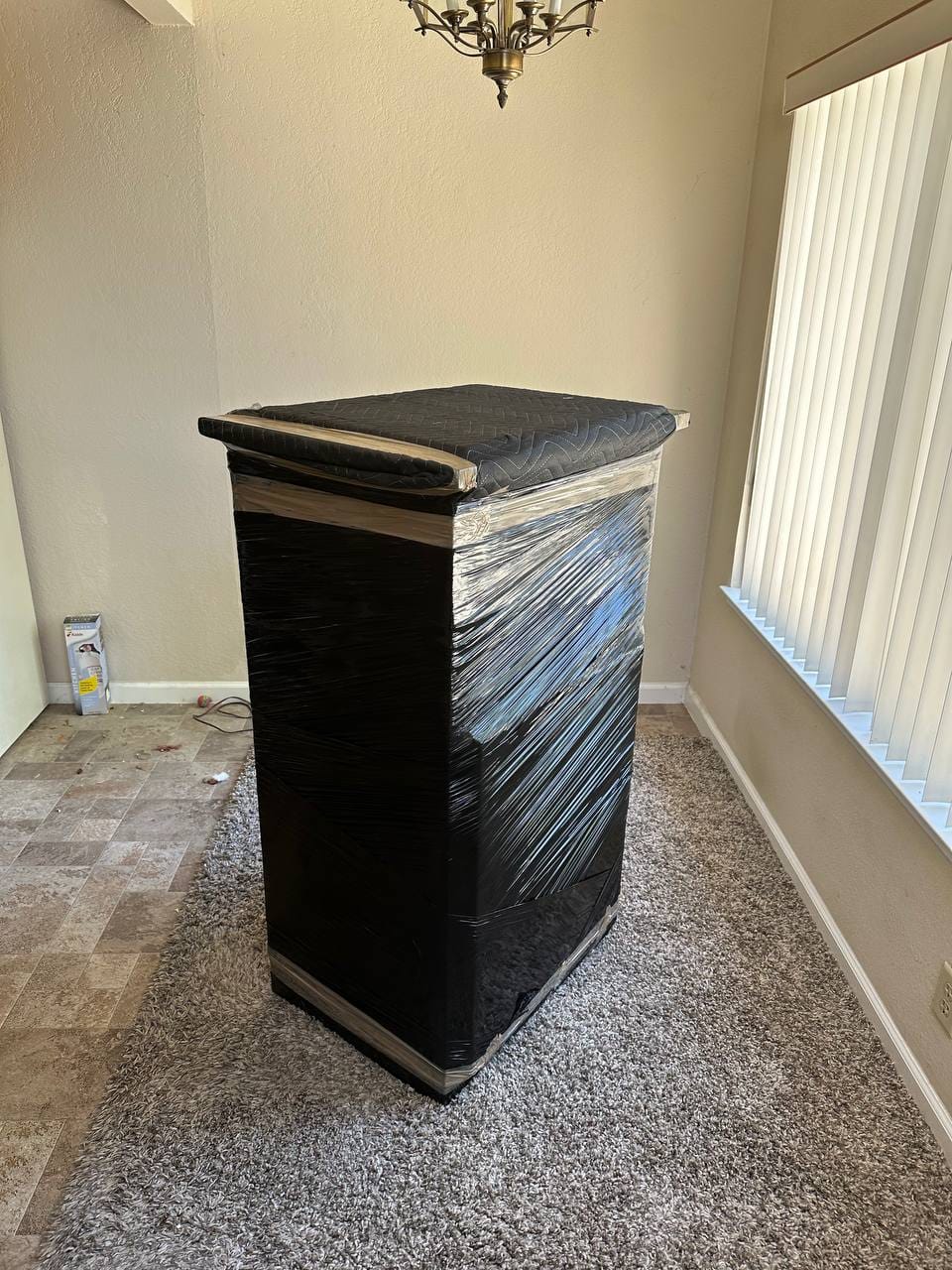 Furniture pad-wrapped and taped by trained Old Florida Moving crews