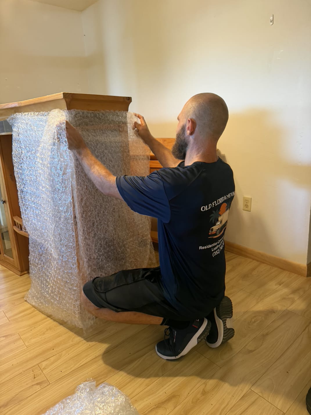 Bubble wrap over china cabinet glass by movers serving Archer and Alachua County FL