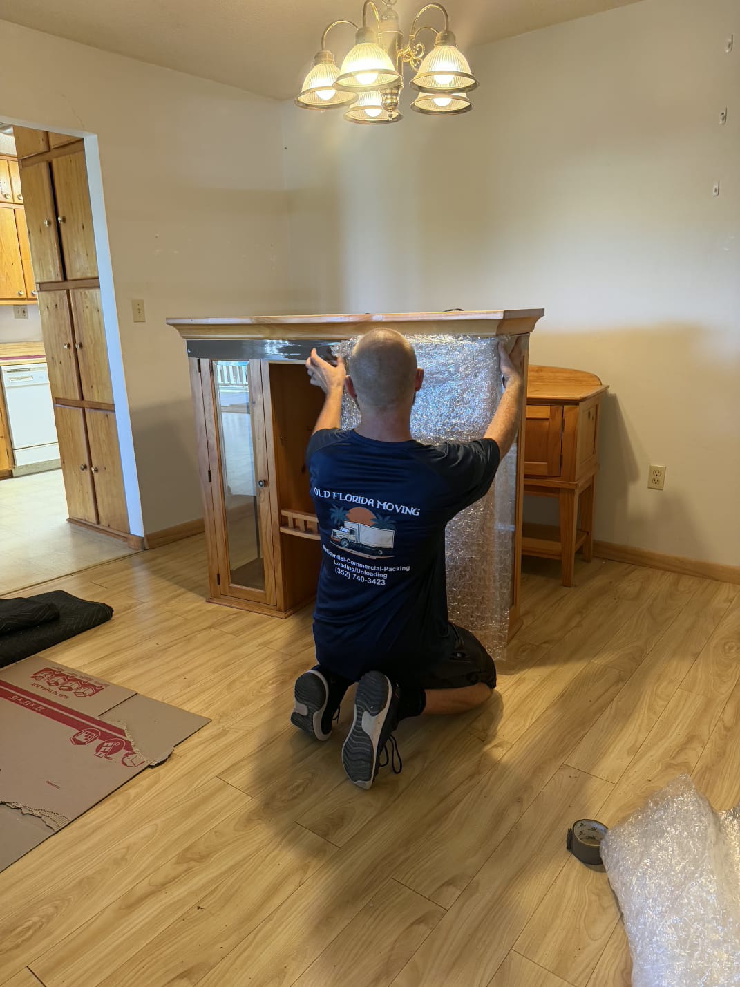 Bubble wrap over china cabinet glass by Old Florida Moving furniture movers