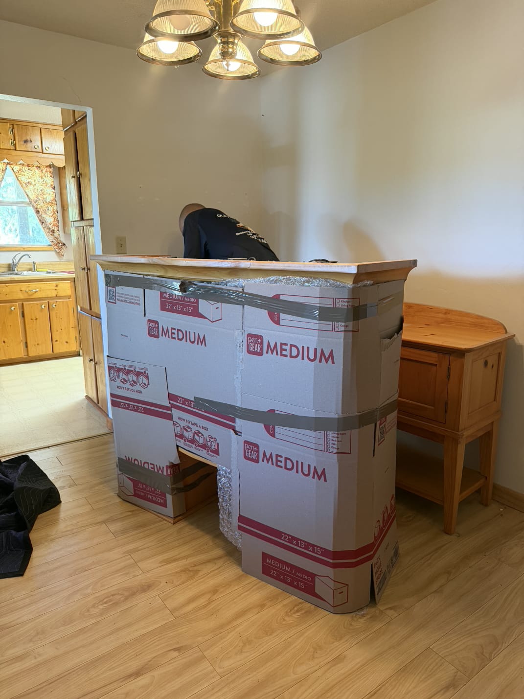 Cardboard crating over cabinet glass by furniture movers serving Newberry FL