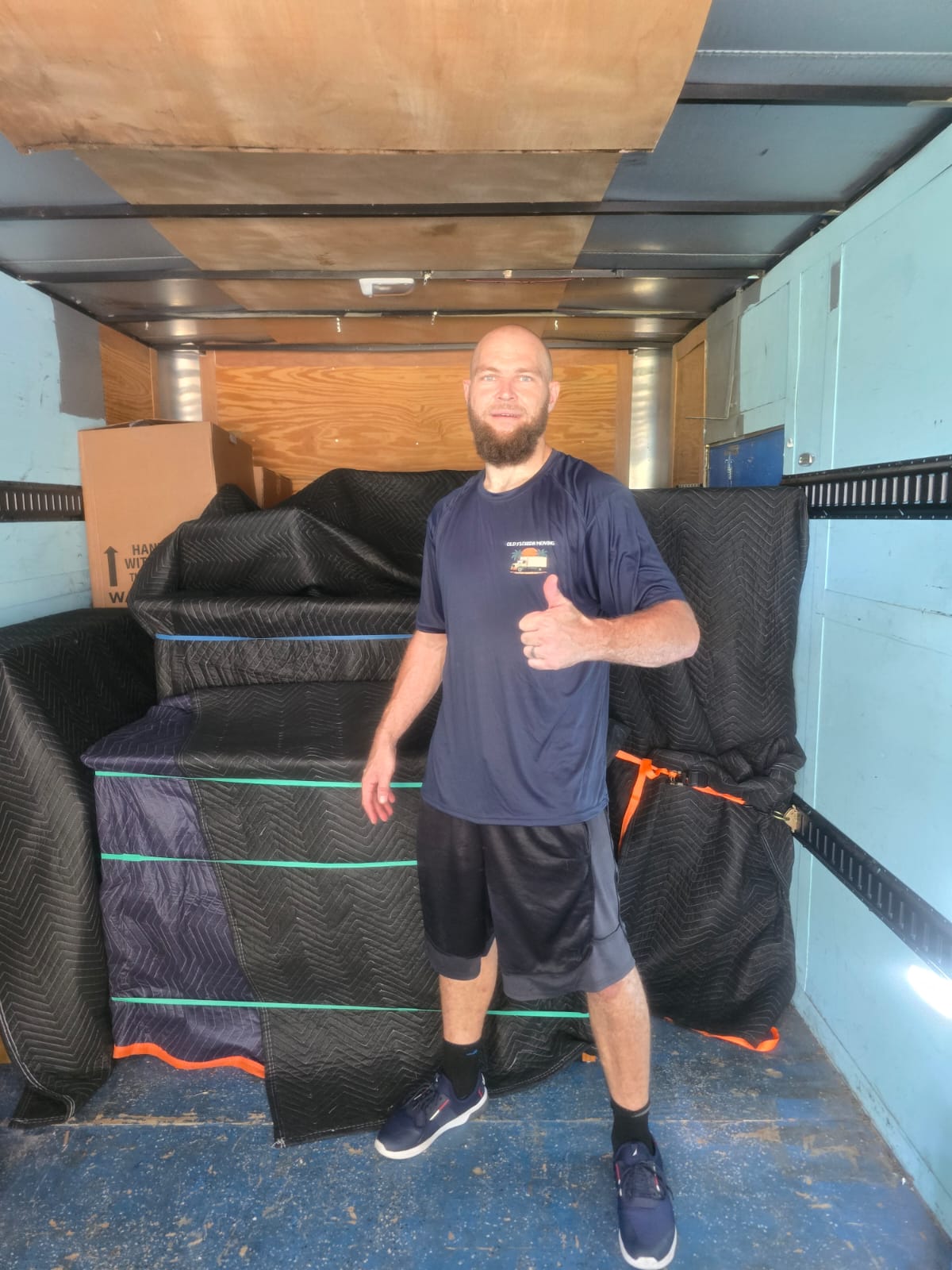 Furniture stacked tight in a trailer by our moving labor crew